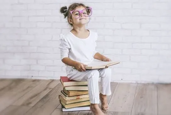 Child with books learning English from scratch